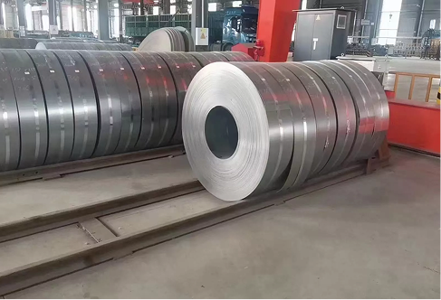 Unwrapped steel coils on a factory production floor