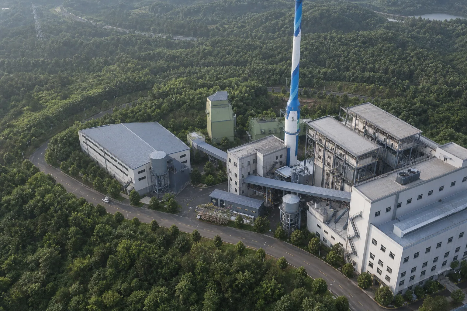 Yongjia cogeneration facility and chimney surrounded by wooded hills